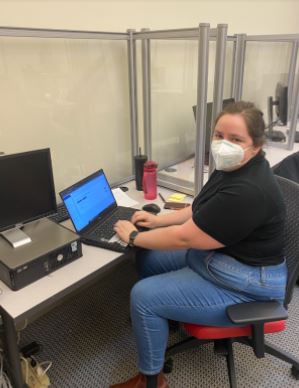 Emma, a tax preparer, sits in front of her laptop ready to help